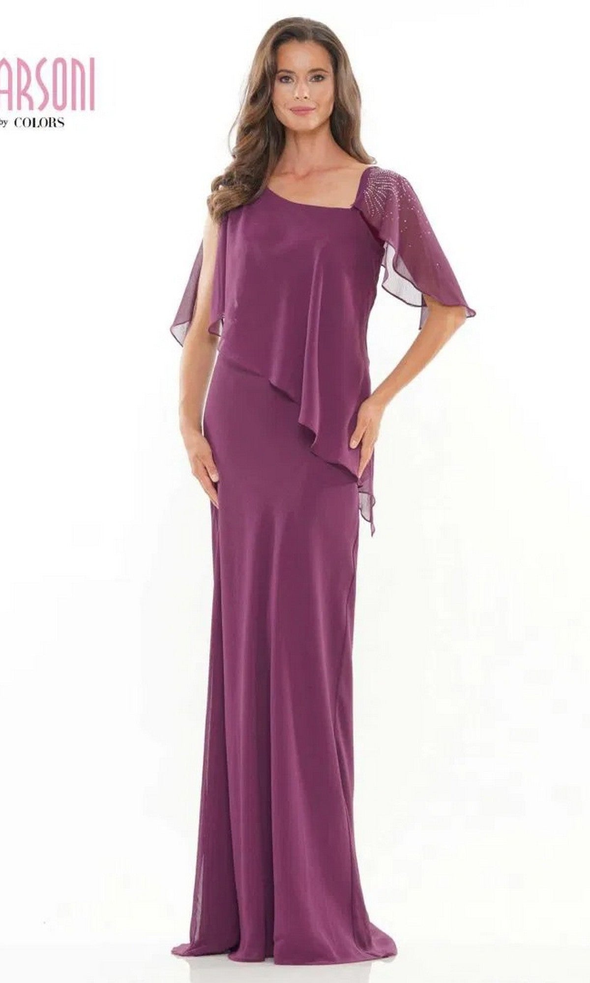 A woman wearing the Marsoni M313 long formal dress in eggplant chiffon, featuring sheer flutter sleeves and beaded embellishments, stands against a plain white background.